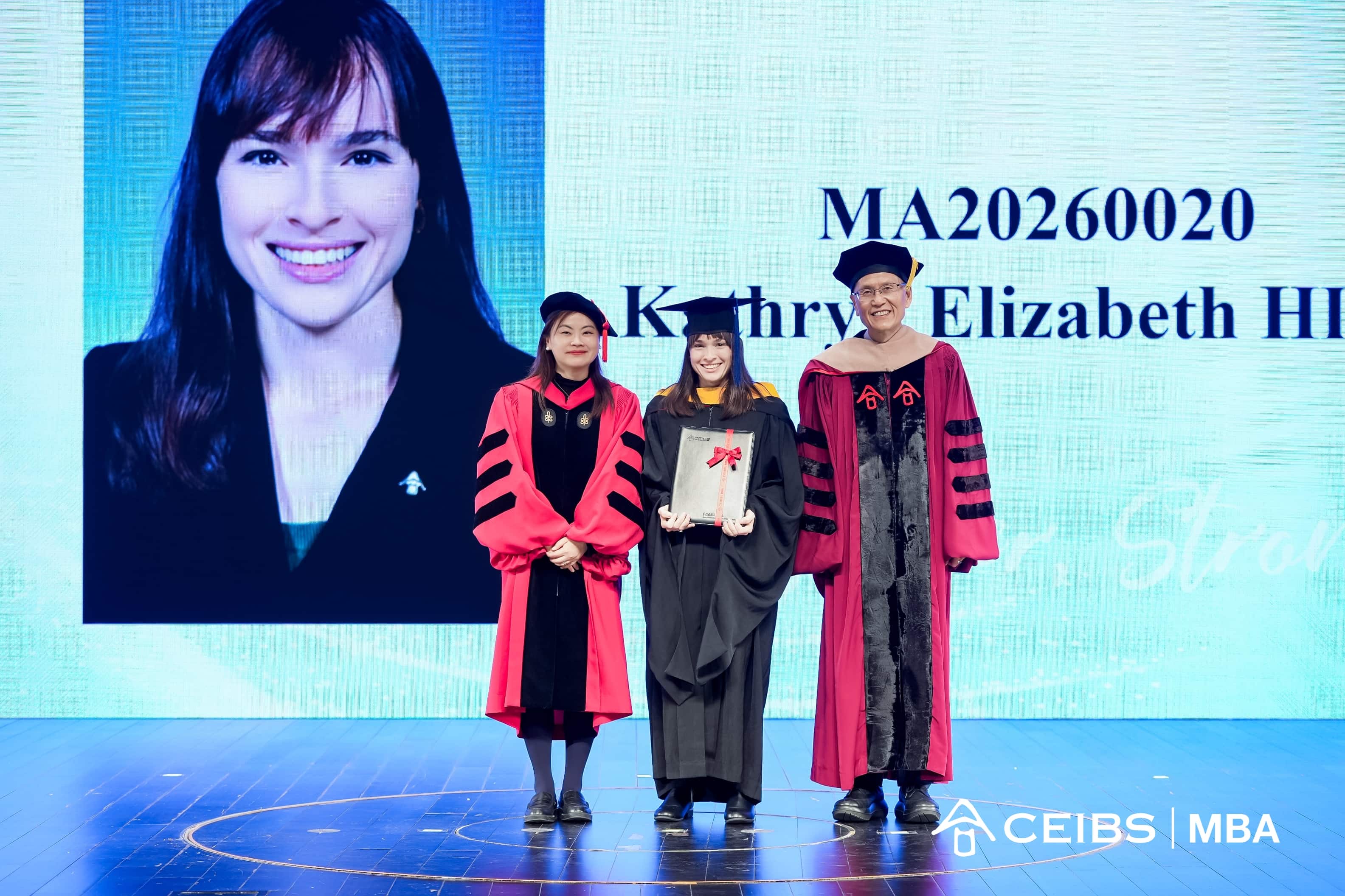 Professors present graduation certificates  to graduates